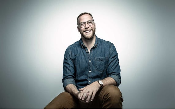 Jennifer Keishin Armstrong holding several of her own books